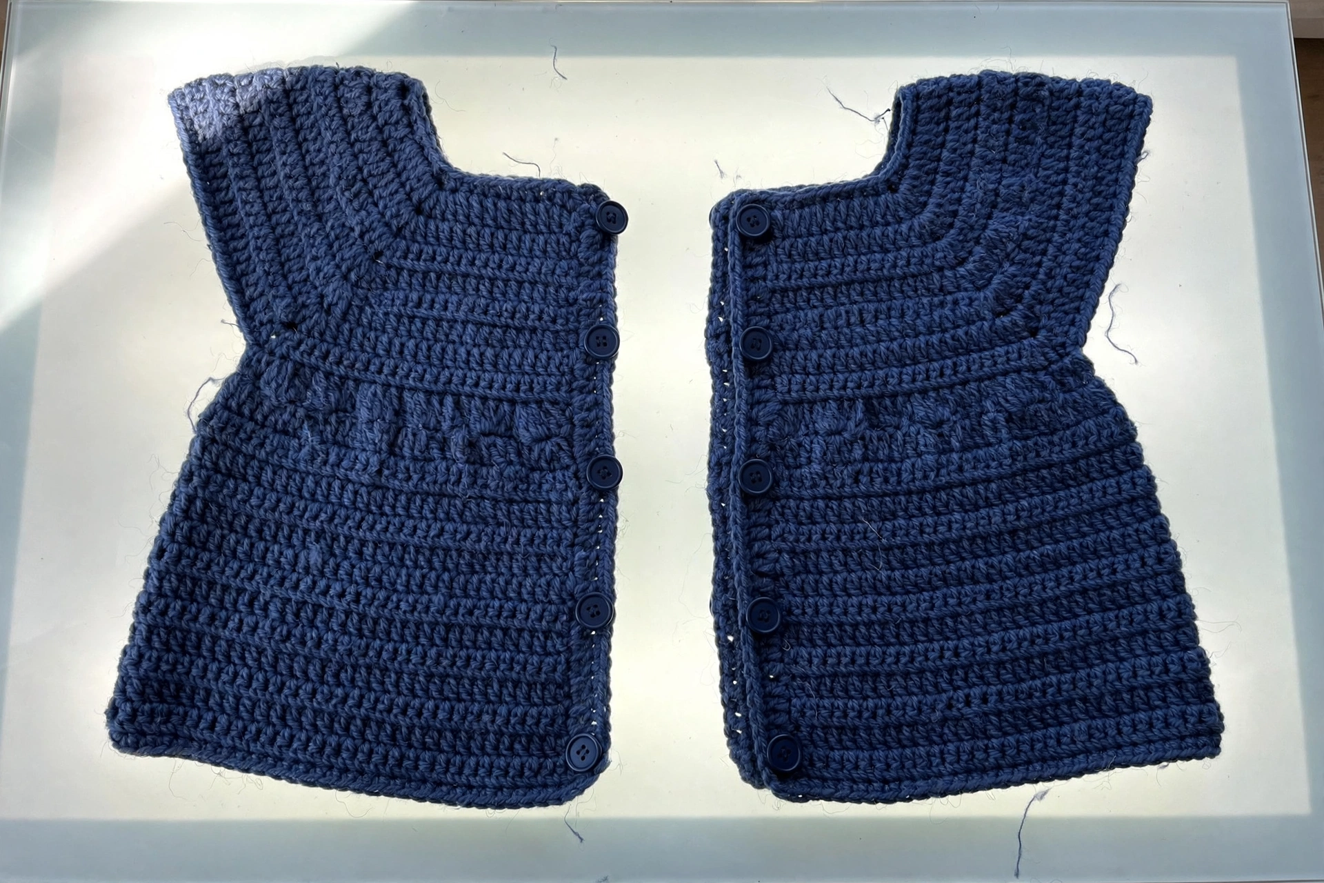Two front panels with double-breasted shaping for the baby peacoat crochet pattern