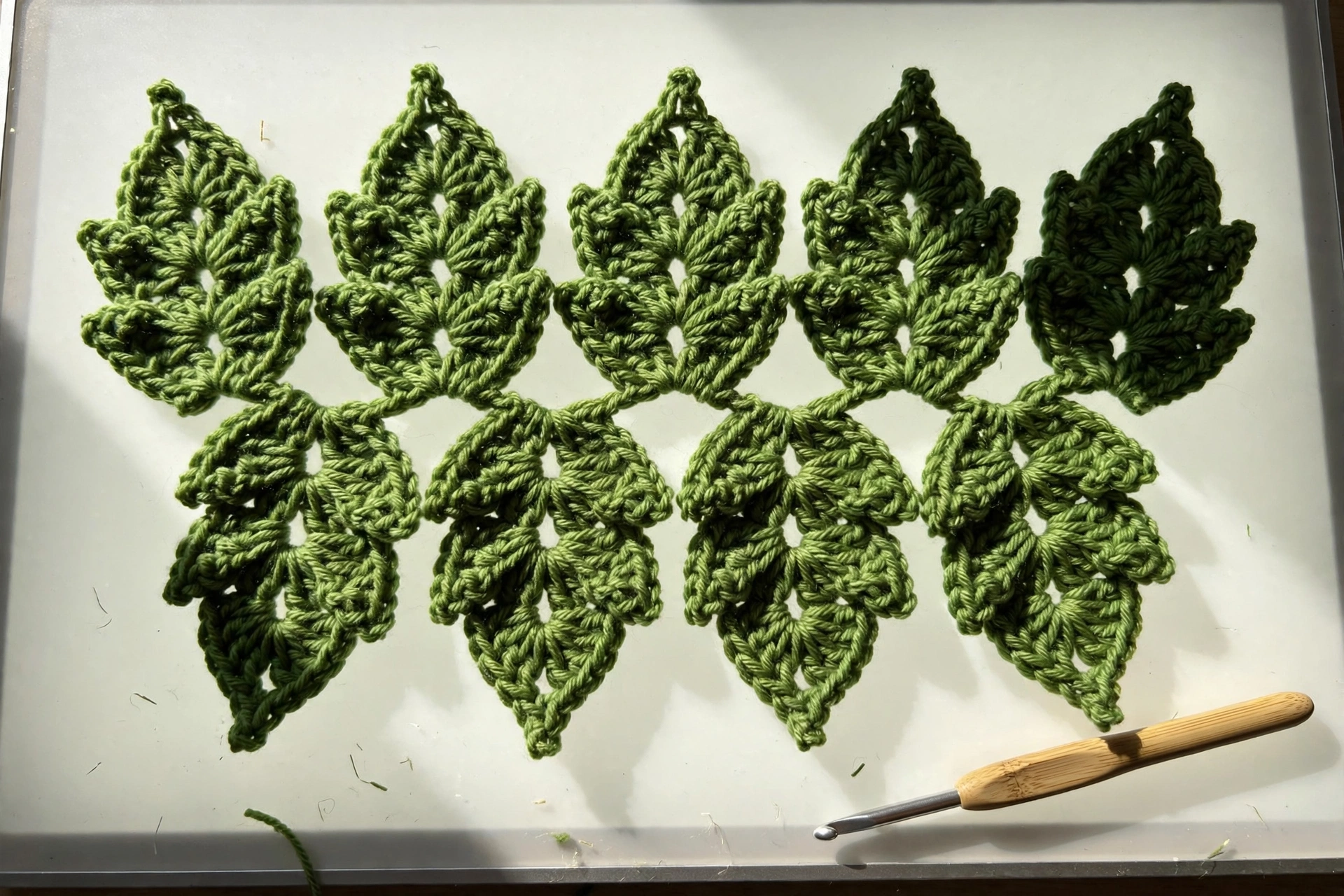 Offset leaf row of the leaf stitch crochet pattern with leaves nesting between the row below